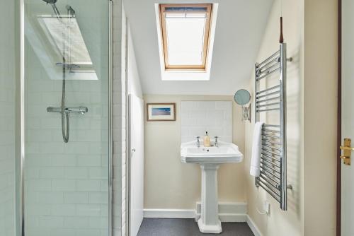 a bathroom with a sink and a shower at The Lansdowne Boutique Rooms with Breakfast - Adults Only in Bourton on the Water