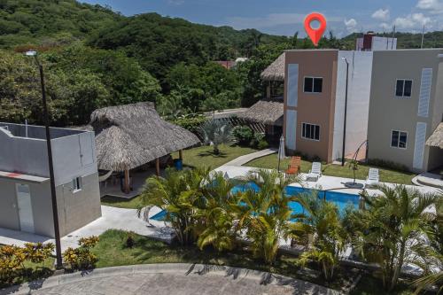 an aerial view of a resort with a swimming pool at Residencial San Agustin Huatulco in Santa Cruz Huatulco