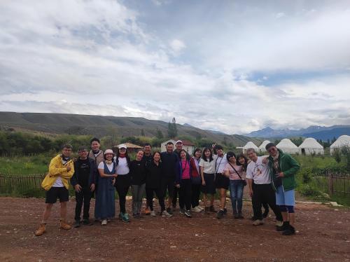 a group of people are posing for a picture at Eco Village Lodge in Dzhetyoguz