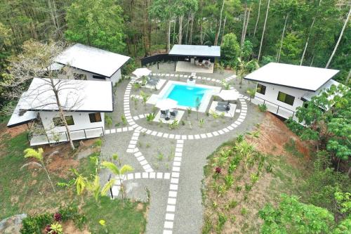 an aerial view of a house with a swimming pool at Sharma Costa Rica - Hawk Casita in Uvita