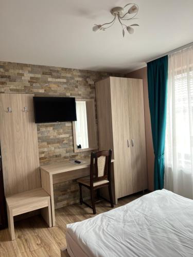 Ένα ή περισσότερα κρεβάτια σε δωμάτιο στο Casa TimEva Azuga