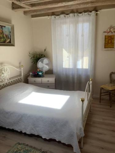 Ένα ή περισσότερα κρεβάτια σε δωμάτιο στο Ambiance Milly la Foret