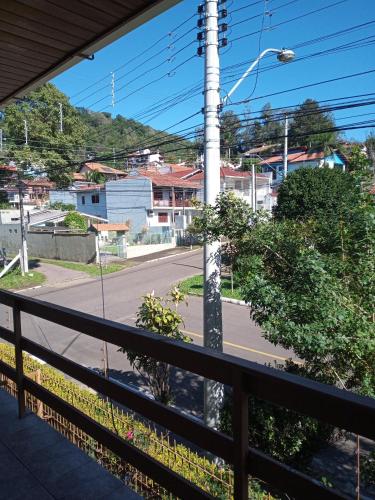 a view of a street from a balcony at Hospedaria das Azaleias in Novo Hamburgo
