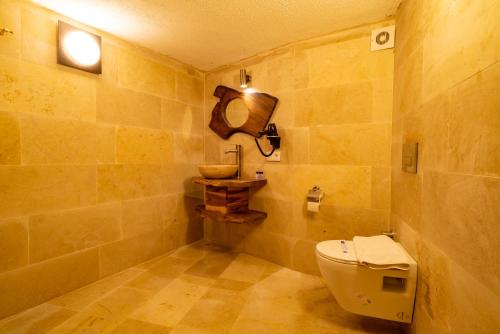 a bathroom with a toilet and a sink at Atilla's Cave Hotel in Nevsehir