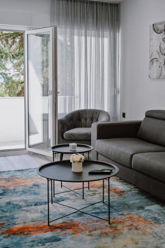 a living room with a couch and a coffee table at Tara in Rijeka