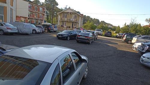 a bunch of cars parked in a parking lot at Apartment Zhemchuzhina Ureki-4 in Ureki