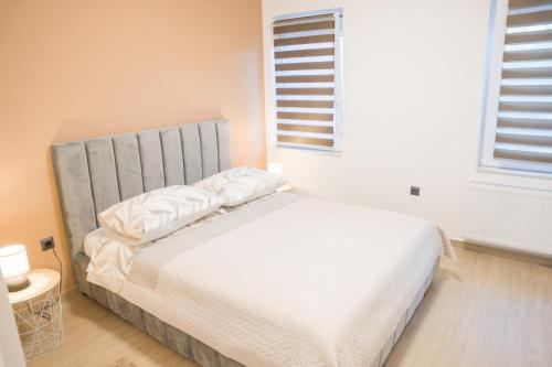 Katil atau katil-katil dalam bilik di Apartmani Toni