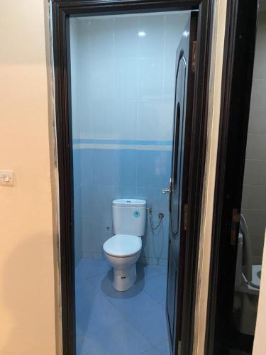 a bathroom with a white toilet in a room at Kassbah legzira in Sidi Ifni