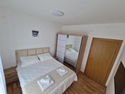 Postel nebo postele na pokoji v ubytování Nina Apartman 3