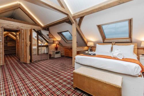 a bedroom with a large bed in a room at Moonlight Barn in Oxford