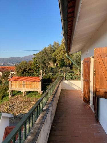 a balcony of a house with a view at Casa da Pedrada in Ponte da Barca