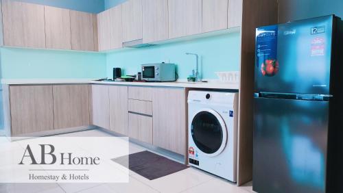 a kitchen with a washer and dryer in it at ABHOME "ART MUSEUM SUITE" #GreenHaven #360"City & Sea View #Masai #JB in Johor Bahru