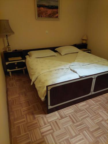 a large bed in a bedroom with a bed sidx sidx sidx at Apartma Kaj in Kaja in Maribor