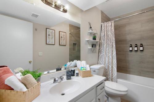 a bathroom with a sink and a toilet and a shower at Modern 2BR Getaway 15mn Phx. Intl Airport in Phoenix