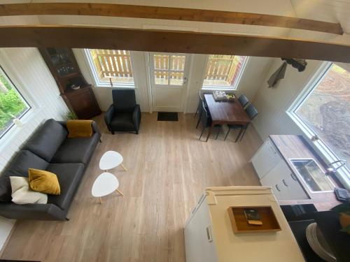 an overhead view of a living room with a couch and a table at Vallakot Farm Guesthouse in Laugar