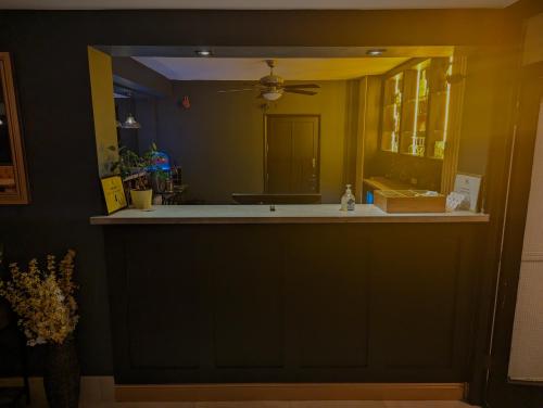 a bathroom with a sink and a mirror at Mayfair Hotel - Isle of Wight in Shanklin