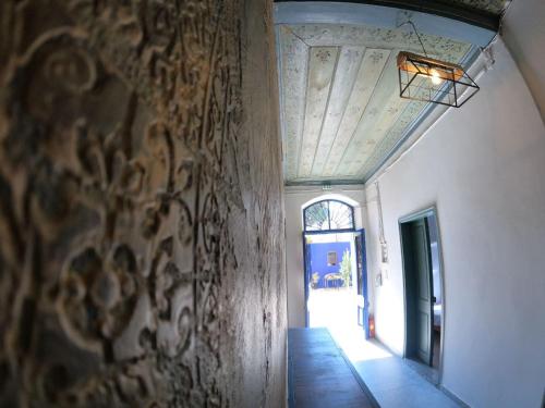 a hallway of a building with a ceiling and a doorway at Rhodes Youth Hostel in Rhodes Town