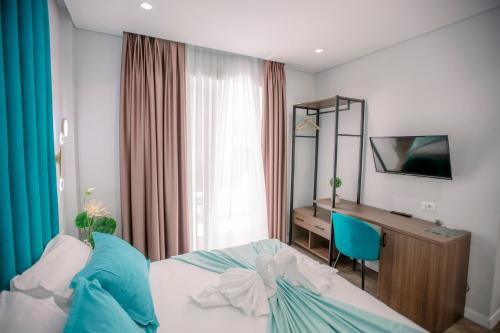 Un ou plusieurs lits dans un hébergement de l'établissement Hotel Olsi