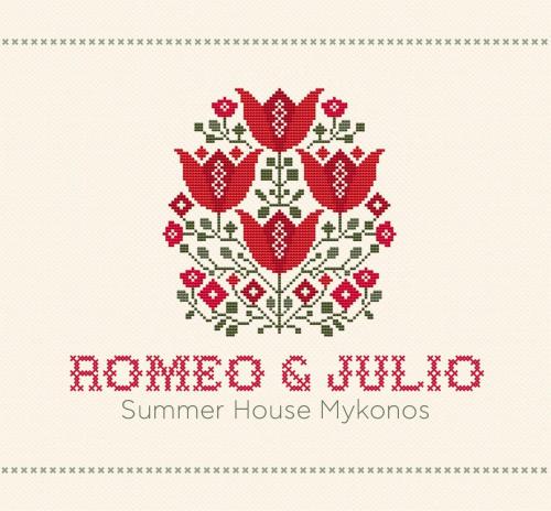 a counted cross stitch pattern of a red house insignia at ROMEO AND JULIO SUMMER HOUSE in Mýkonos City