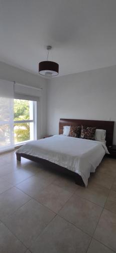 מיטה או מיטות בחדר ב-Terrazas de Playa Blanca 1B