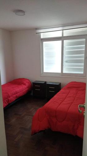 Postel nebo postele na pokoji v ubytování Casa Necochea 1664