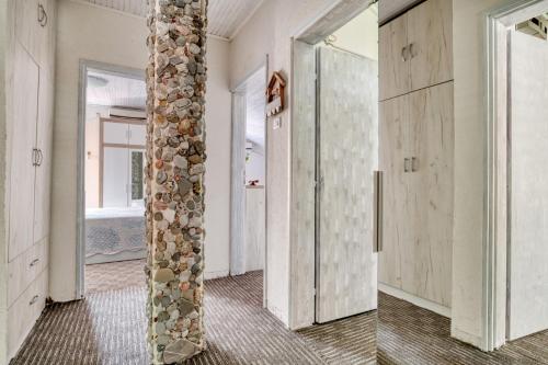 a room with a pillar and a door at Baka Zlata Apartments in Petrovac na Moru