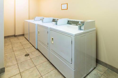 a row of white cabinets in a room at Comfort Inn & Suites Salmon Arm in Salmon Arm