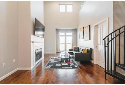 a living room with a couch and a fireplace at Downtown Shared Apartment in Providence