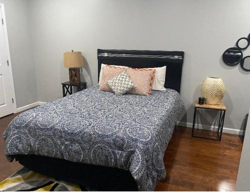 a bedroom with a bed with pillows on it at Downtown Shared Apartment in Providence