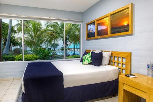 Giường trong phòng chung tại Atami Escape Resort