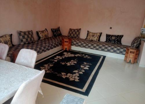 a living room with a couch and a rug at Villa for daily rent فيلا للكراء اليومي in Marrakesh