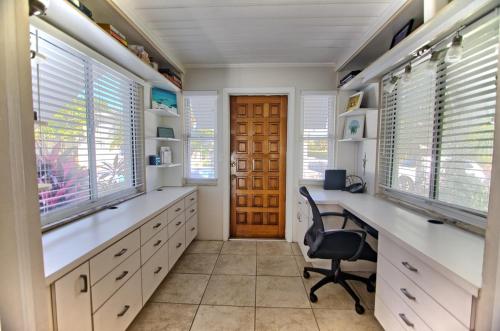 a home office with a desk and a chair at Gulfside Resort. Unit 1 in St. Pete Beach