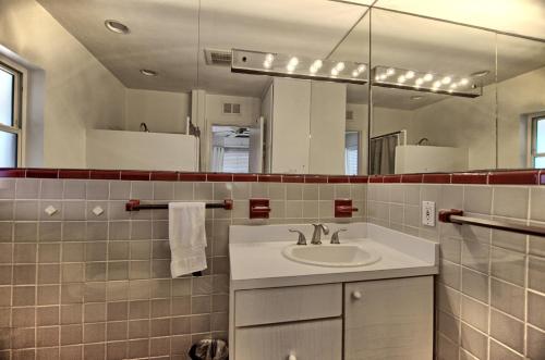 a bathroom with a sink and a mirror at Gulfside Resort Unit 2 in St. Pete Beach