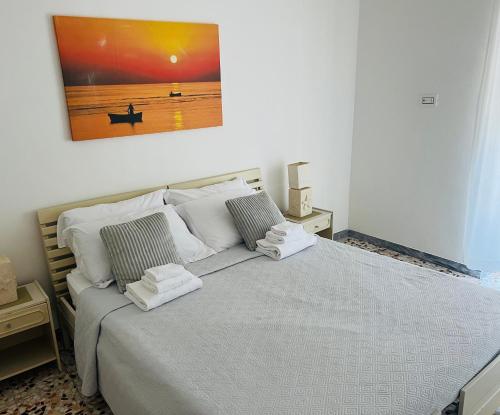 Postel nebo postele na pokoji v ubytování Savelletri Miramare