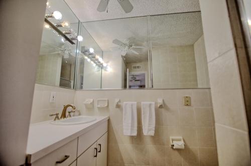 a bathroom with a sink and a mirror at Gulfside Resort. Unit 3 in St. Pete Beach