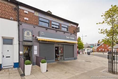 a store front of a building on a street at Rainbow Heights Dublin in Dublin