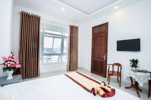 TV a/nebo společenská místnost v ubytování Tuấn An Hotel