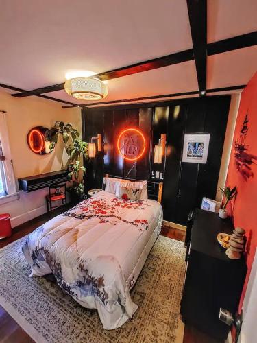 a bedroom with a bed and a sign on the wall at World Solo Travel's Welcomed At St Pete Home in St. Petersburg