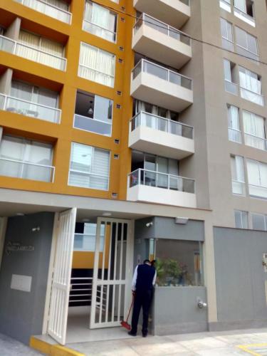 a man standing outside of a building at TUNA HOSTEL in Lima