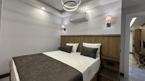 a bedroom with a bed in a room at Quality Gold Suite Hotel in Antalya