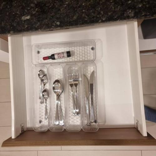 a plastic container with utensils in a kitchen at Suite Martina 2 Personas Quito in Quito