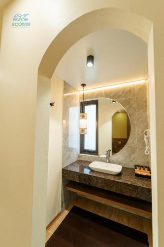 a bathroom with a sink and a mirror at CAO BANG ECO HOUSE in Cao Bằng