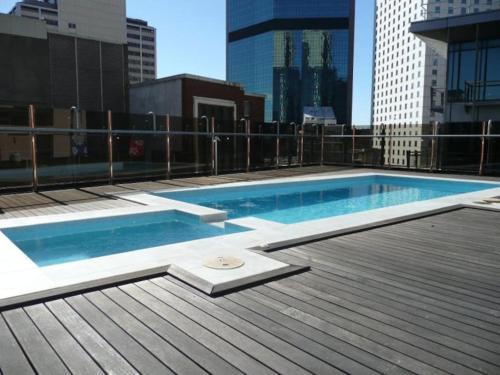 a swimming pool on the roof of a building at CLIVE-Heart of Sydney, Modern, Rooftop Pool Access in Sydney