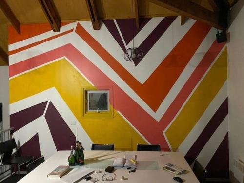 a room with a colorful wall with a table at Sub-Zero Mt Hotham in Mount Hotham