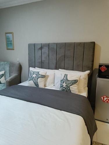 Cama o camas de una habitación en Metro Manor Near JKIA