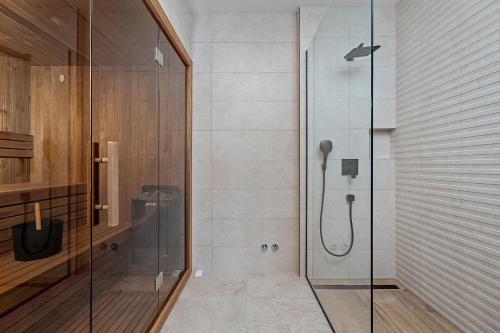 a shower with a glass door in a bathroom at Villa Loma, Brzet, Omiš in Omiš