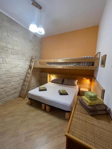 a room with two bunk beds and a staircase at Casa Mia in Donnalucata