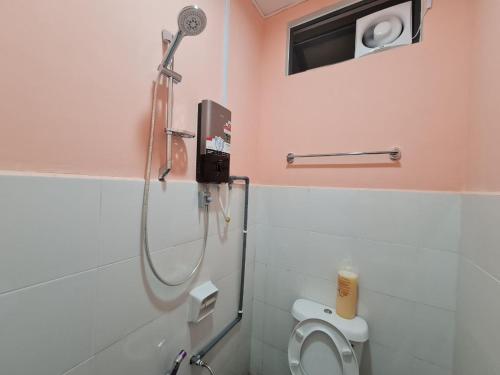 a bathroom with a shower stall with a toilet at Ayden Hostel Airport Transit - KLIA in Sepang