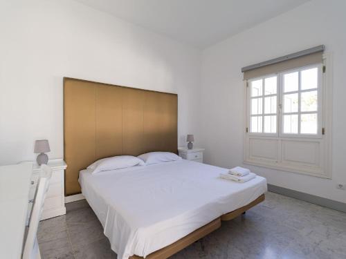 Ένα ή περισσότερα κρεβάτια σε δωμάτιο στο Pasito Villas