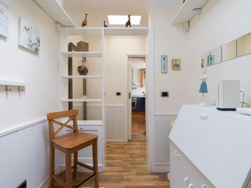 a kitchen with a desk and a chair in a room at Orinoco Suites Puerto Rico in Puerto Rico de Gran Canaria
